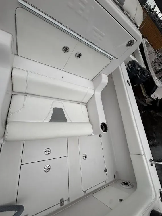 Slide: The Image of 2020 SeaVee 340Z boat interior with white seating and storage compartments. - 10