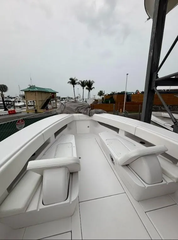 Slide: The Image of 2020 SeaVee 340Z boat with spacious deck, docked at marina. - 2