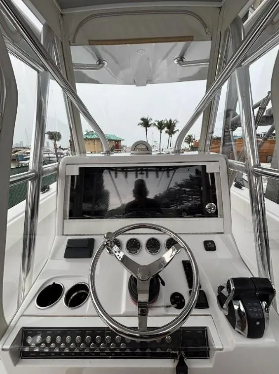 Slide: The Image of 2020 SeaVee 340Z boat helm with modern controls and steering wheel. - 5
