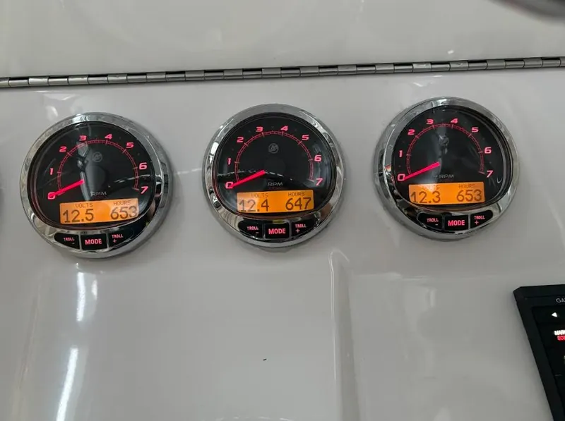 Slide: The Image of Dashboard gauges of a 2020 SeaVee 340Z boat displaying RPM and engine data. - 7