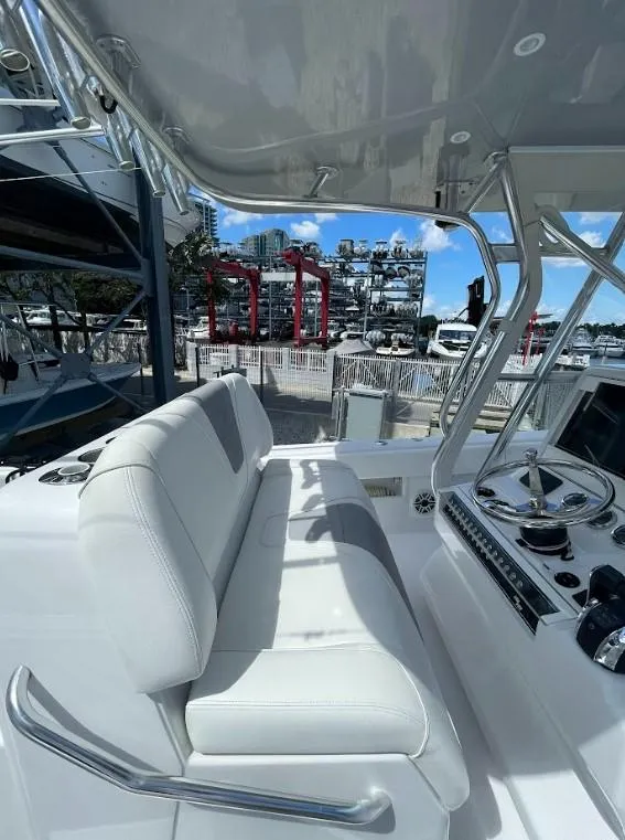 Slide: The Image of 2020 SeaVee 340Z boat interior with white seating and control panel. - 8