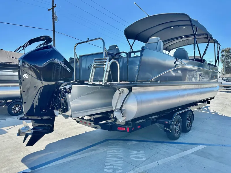 Slide: The Image of 2021 Avalon Catalina Rear Fish 23' pontoon boat with 200HP Mercury engine on trailer. - 15