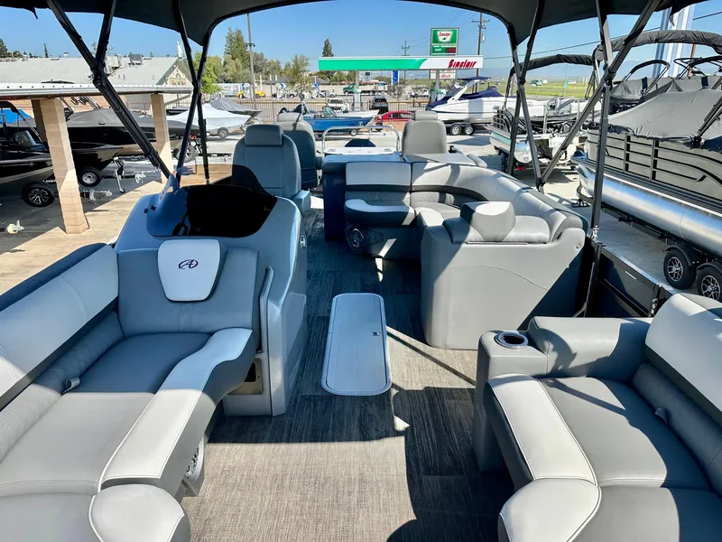 Slide: The Image of 2021 Avalon Catalina Rear Fish 23' boat interior with luxurious seating and modern design. - 16