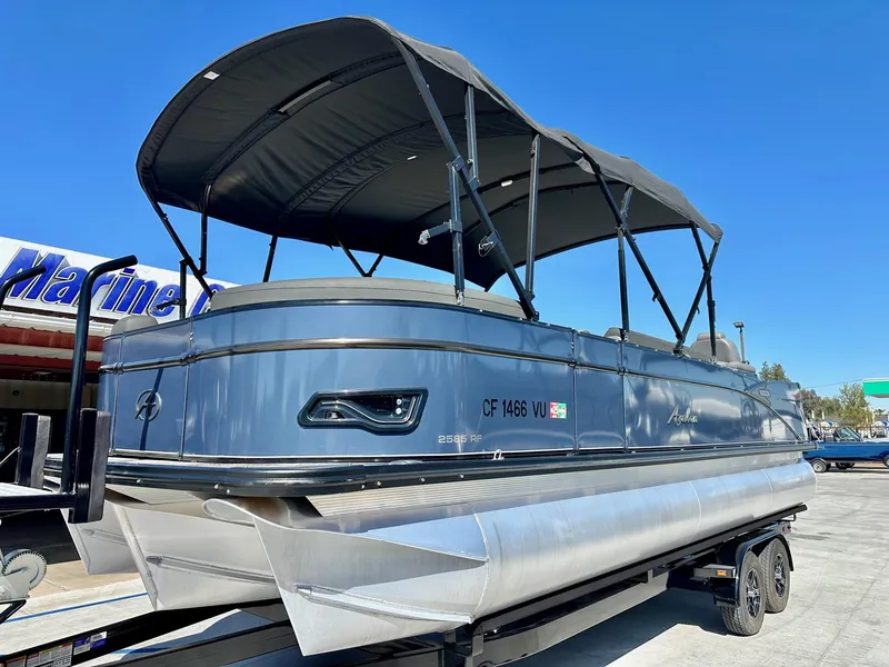 Slide: The Image of 2021 Avalon Catalina Rear Fish 23' pontoon boat with 200HP Mercury engine, on trailer. - 2