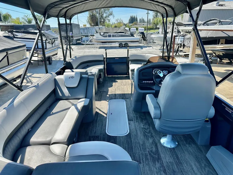 Slide: The Image of 2021 Avalon Catalina Rear Fish 23' boat interior with seating and steering console. - 20
