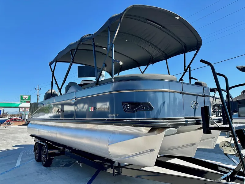Slide: The Image of 2021 Avalon Catalina Rear Fish 23' pontoon boat with 200HP Mercury, on trailer, under blue sky. - 3