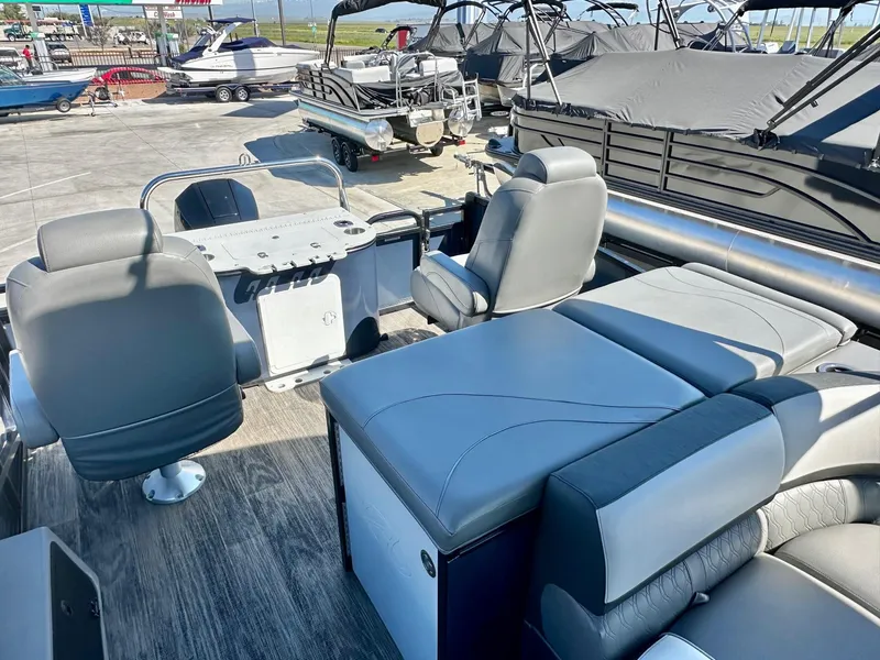 Slide: The Image of 2021 Avalon Catalina Rear Fish 23' boat interior with seating and helm, featuring 200HP Mercury engine. - 8