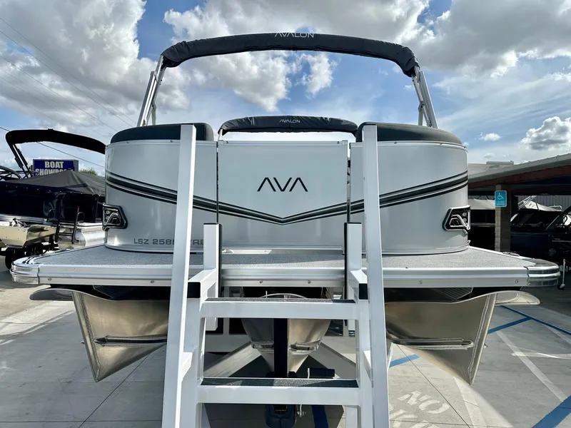Slide: The Image of 2025 Avalon 25' LSZ Platinum Versatile Rear Bench pontoon boat with 225HP Mercury engine. - 10