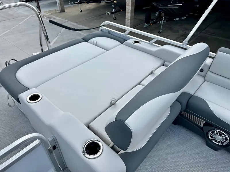Slide: The Image of 2025 Avalon 25' LSZ Platinum boat with versatile rear bench seating and cup holders. - 14