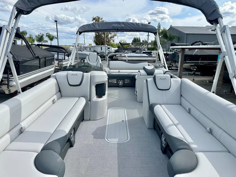 Slide: The Image of 2025 Avalon 25' LSZ Platinum boat with versatile rear bench and 225HP Mercury engine. - 4