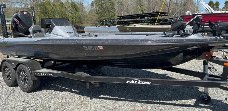 Slide: The Image of 2023 Falcon F20 Predator boat on trailer, parked outdoors. - 1