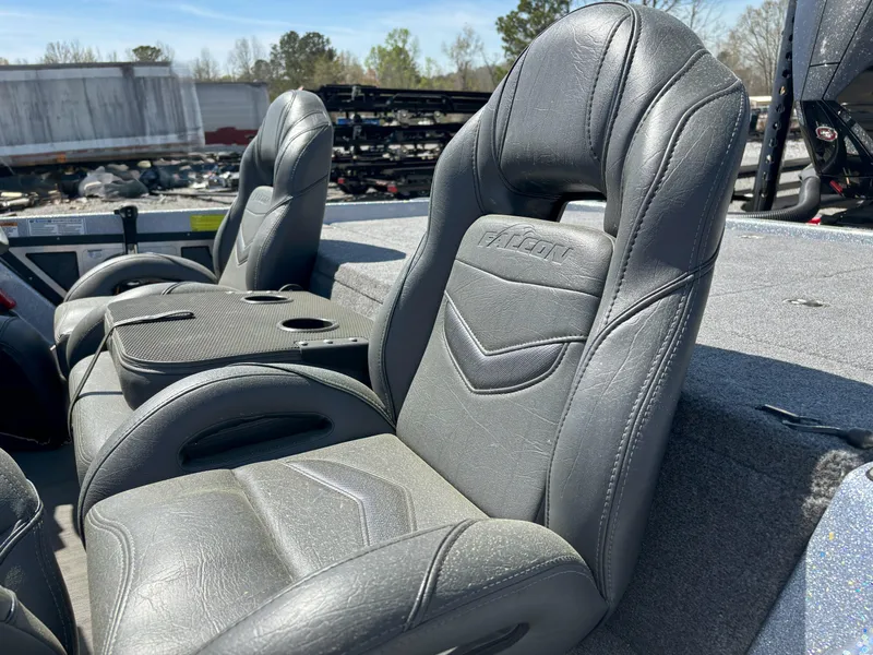 Slide: The Image of 2023 Falcon F20 PREDATOR boat seats, gray leather, outdoor setting. - 12