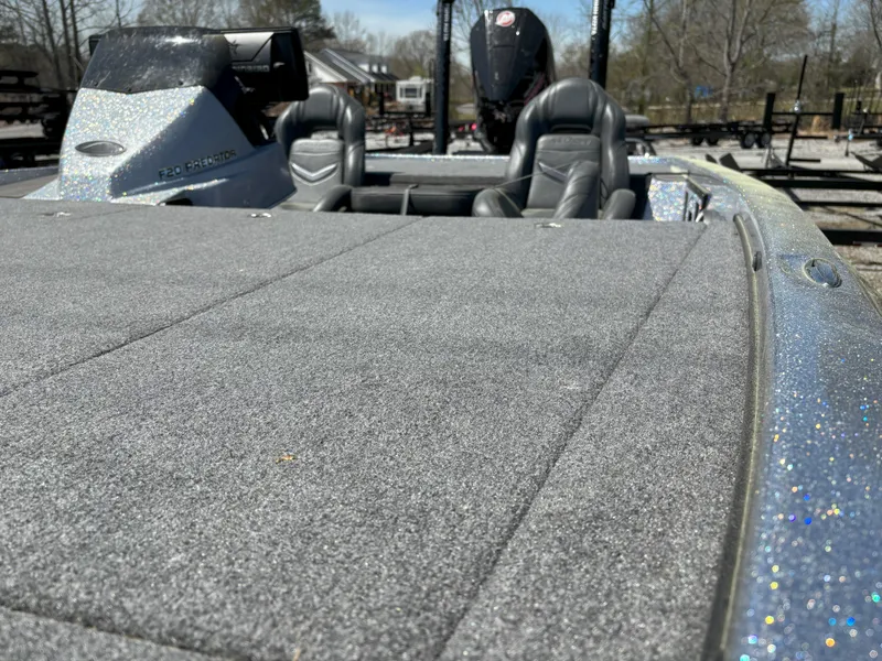 Slide: The Image of 2023 Falcon F20 PREDATOR boat with glitter finish, featuring spacious deck and seating. - 5