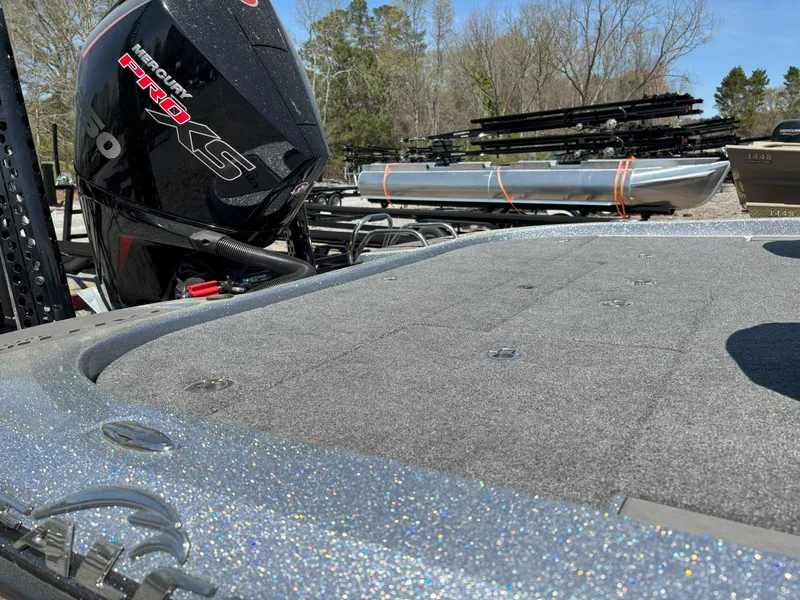 Slide: The Image of 2023 Falcon F20 PREDATOR boat with Mercury Pro XS engine, parked outdoors. - 6