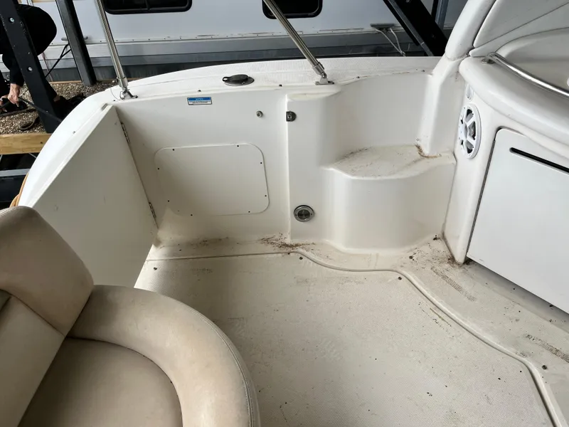 Slide: The Image of 2006 Sea Ray 340 Sundancer boat interior, featuring seating and storage compartments. - 11