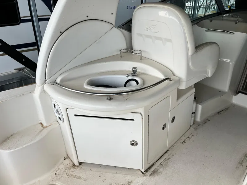 Slide: The Image of 2006 Sea Ray 340 Sundancer boat interior with sink and storage area. - 12