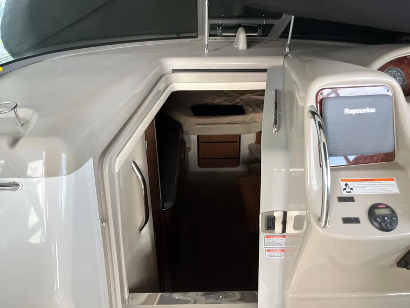 Slide: The Image of 2006 Sea Ray 340 Sundancer cabin entrance with Raymarine navigation system. - 14