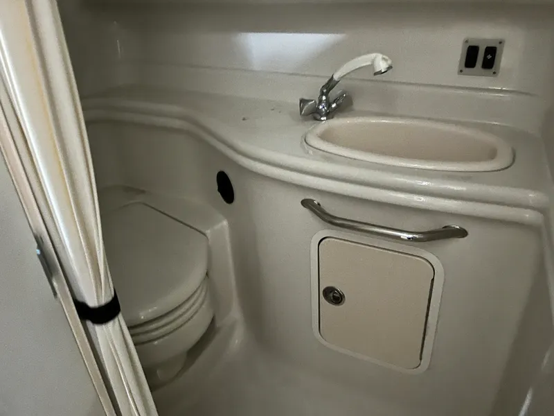 Slide: The Image of 2006 Sea Ray 340 Sundancer bathroom with sink and toilet. - 22