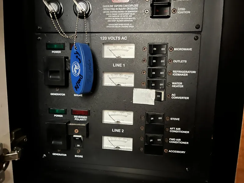 Slide: The Image of Electrical control panel of a 2006 Sea Ray 340 Sundancer boat. - 26