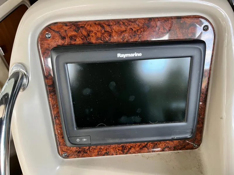 Slide: The Image of Raymarine display on 2006 Sea Ray 340 Sundancer boat dashboard with wood trim. - 28