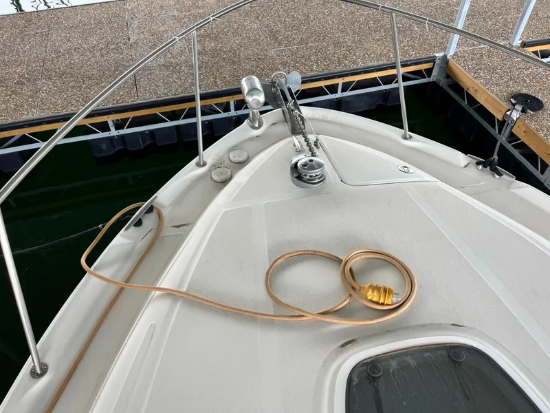Slide: The Image of Bow of 2006 Sea Ray 340 Sundancer with coiled rope and anchor. - 30