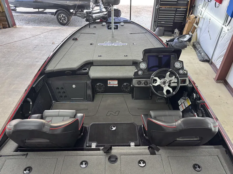 Slide: The Image of 2024 Nitro Z20 Pro boat interior with dual seats, steering wheel, and control panel. - 13