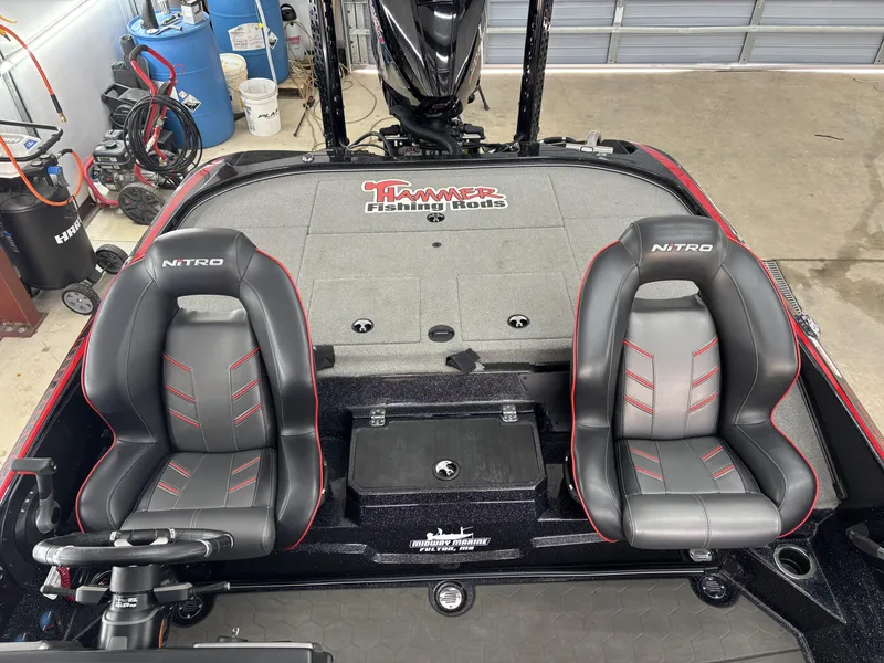 Slide: The Image of 2024 Nitro Z20 Pro boat interior with dual seats and fishing rod storage. - 17
