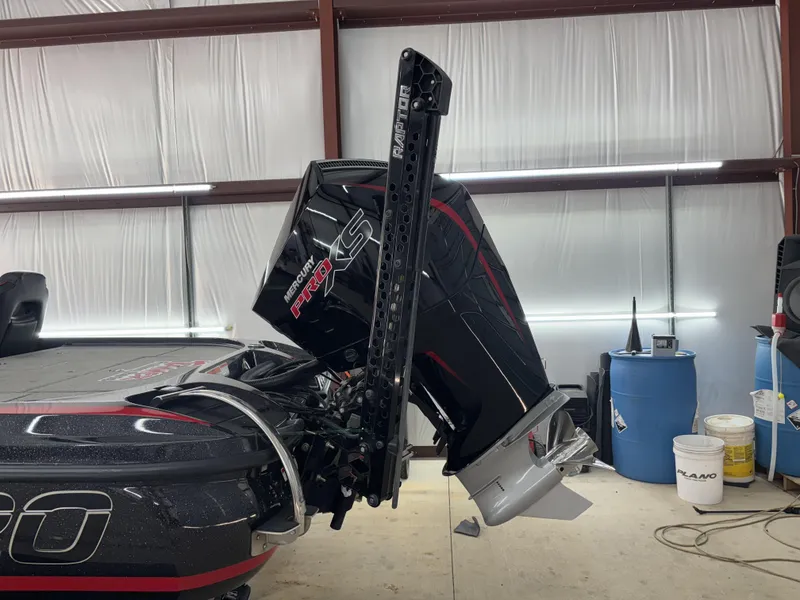 Slide: The Image of 2024 Nitro Z20 Pro boat with Mercury Pro XS engine in a garage setting. - 5