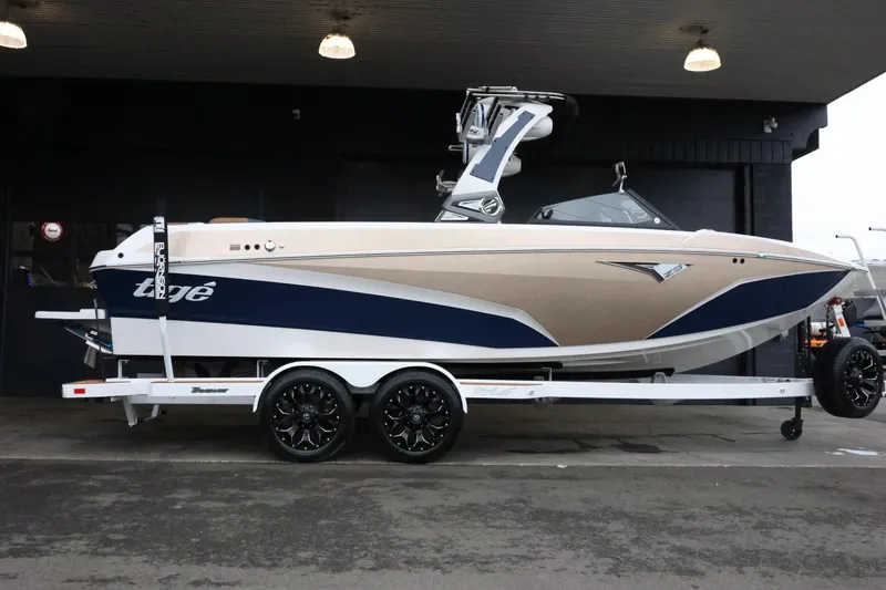 Slide: The Image of 2021 Tigé Z3 boat on trailer, under covered area, side view. - 1