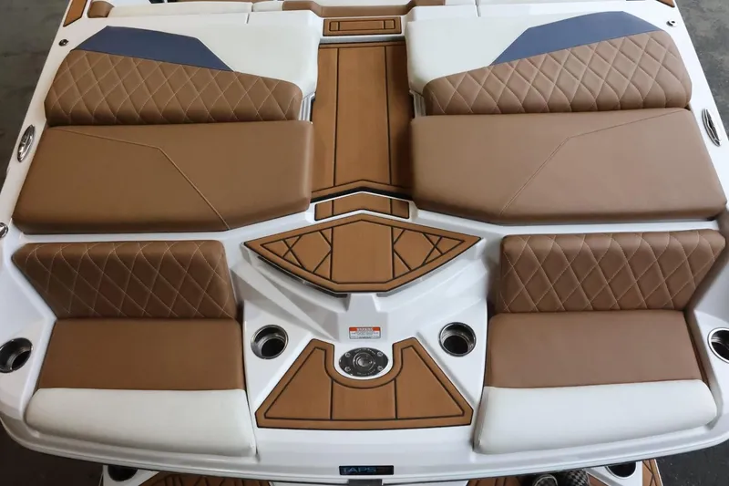 Slide: The Image of 2021 Tigé Z3 boat interior with brown and white cushioned seating. - 10