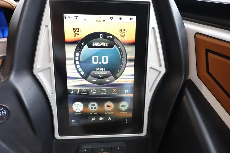 Slide: The Image of 2021 Tigé Z3 boat dashboard with digital display showing speed and controls. - 22