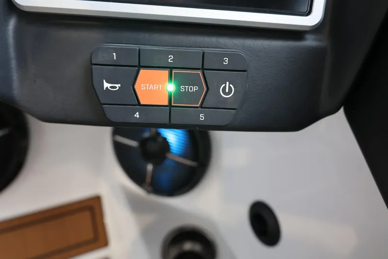 Slide: The Image of Control panel of 2021 Tigé Z3 boat with start, stop, and power buttons. - 26