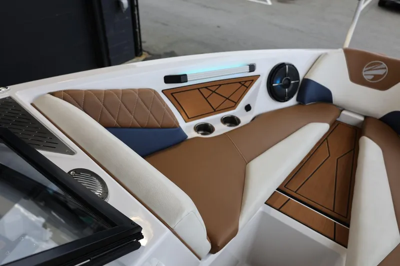 Slide: The Image of 2021 Tigé Z3 boat interior with brown and white seating, modern design elements. - 29
