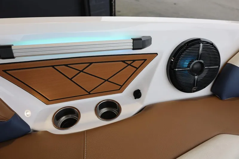 Slide: The Image of Interior detail of 2021 Tigé Z3 boat with speaker, cup holders, and geometric panel design. - 36