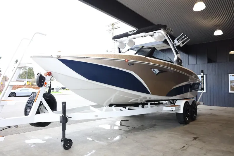 Slide: The Image of 2021 Tigé Z3 boat on trailer, displayed indoors, featuring sleek design and modern features. - 4