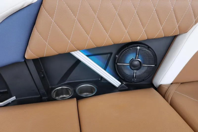 Slide: The Image of 2021 Tigé Z3 interior with tan leather seats, speaker, and cup holders. - 41
