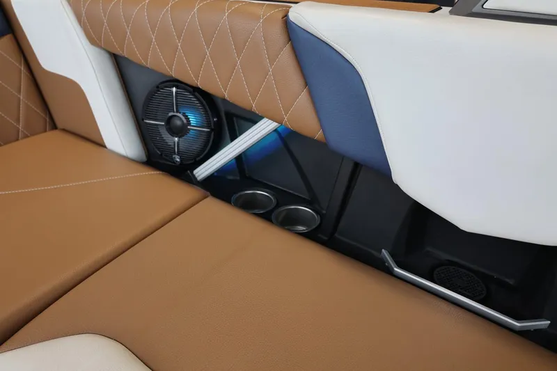 Slide: The Image of 2021 Tigé Z3 interior with brown and white leather seats, speaker, and cup holders. - 43