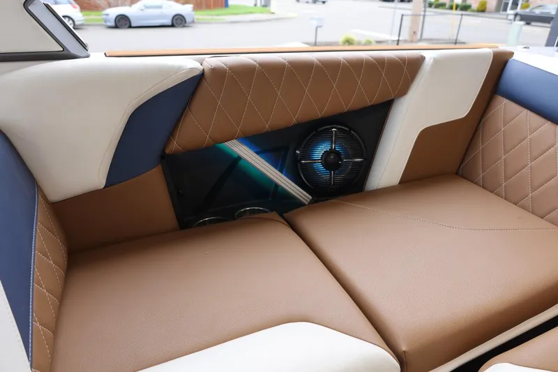 Slide: The Image of Luxurious interior of 2021 Tigé Z3 boat with brown and white seating. - 44