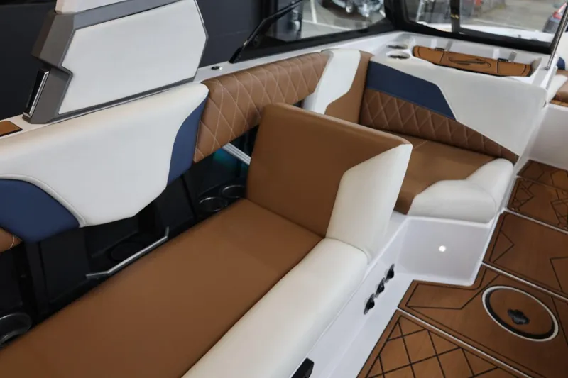 Slide: The Image of 2021 Tigé Z3 boat interior with brown and white seating, diamond-patterned upholstery. - 45