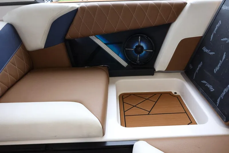 Slide: The Image of 2021 Tigé Z3 interior with brown and white seating, featuring a built-in speaker. - 49