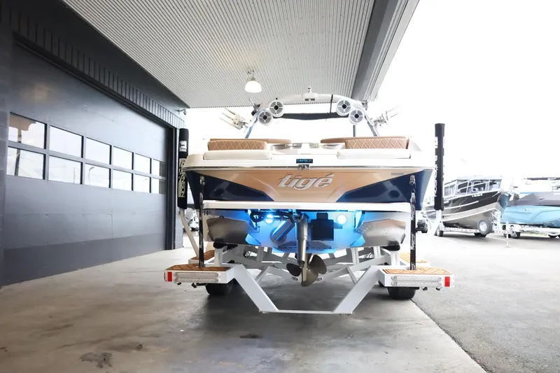 Slide: The Image of 2021 Tigé Z3 boat with illuminated blue lights on trailer in a garage. - 7