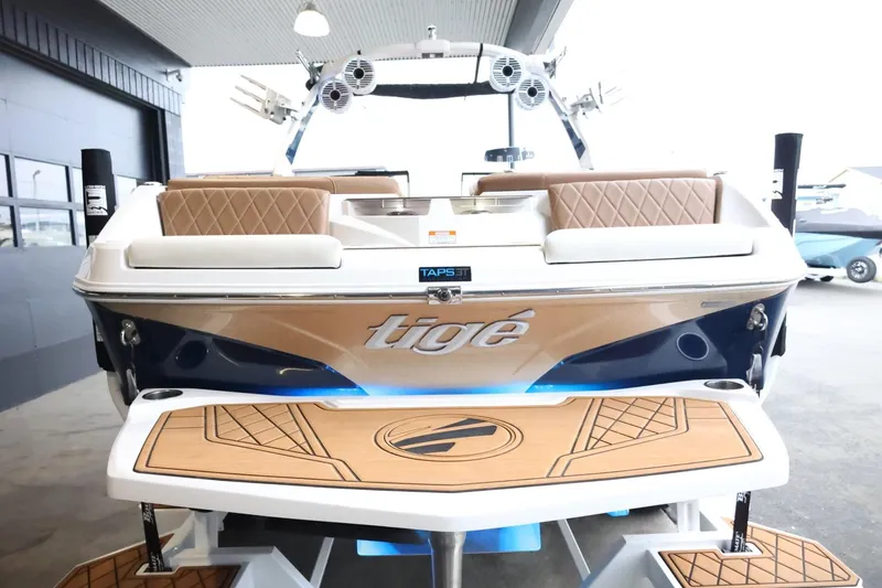 Slide: The Image of 2021 Tigé Z3 boat rear view with stylish seating and deck design. - 8