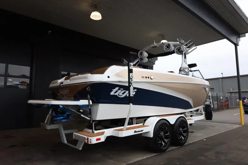 Slide: The Image of 2021 Tigé Z3 boat on trailer, parked under a roof, showcasing sleek design and modern features. - 9