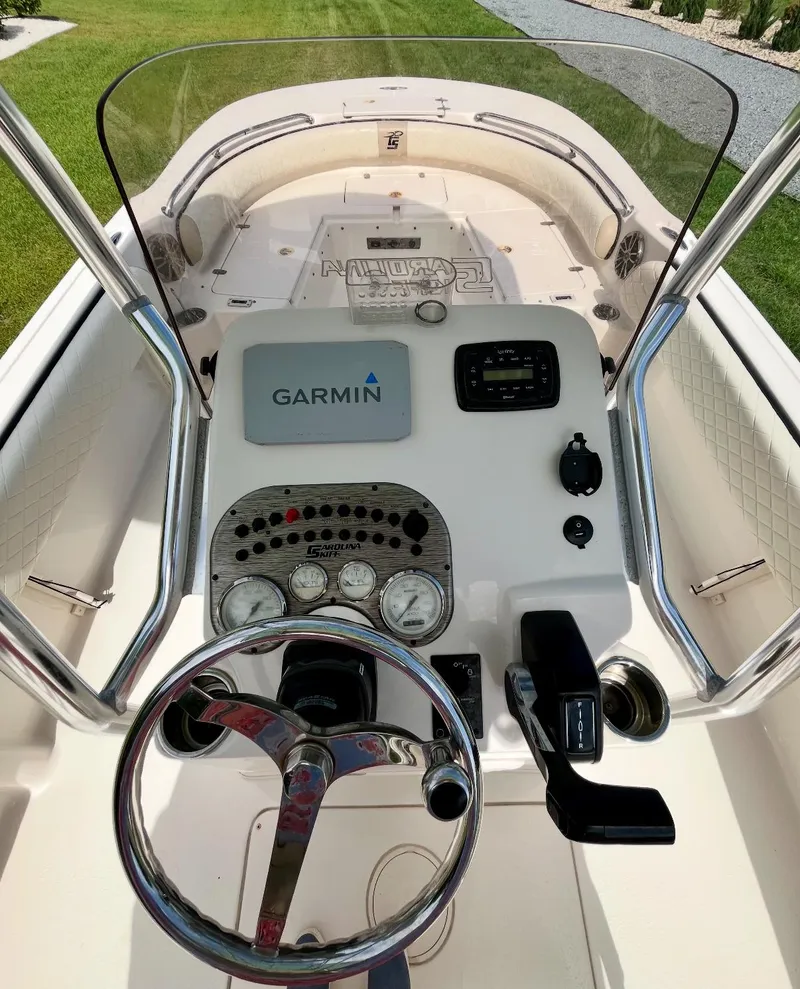 Slide: The Image of 2020 Carolina Skiff 21 Ultra Elite boat dashboard with Garmin navigation system. - 13