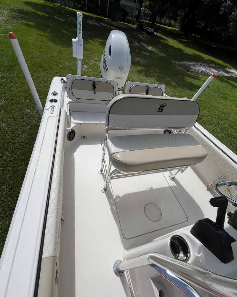 Slide: The Image of 2020 Carolina Skiff 21 Ultra Elite boat interior with seating and controls. - 15