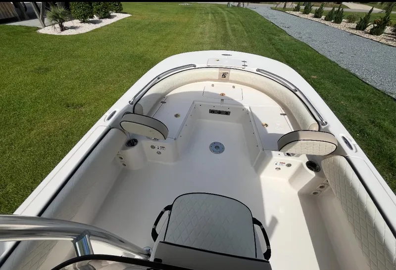 Slide: The Image of 2020 Carolina Skiff 21 Ultra Elite boat interior with seating and storage compartments. - 18