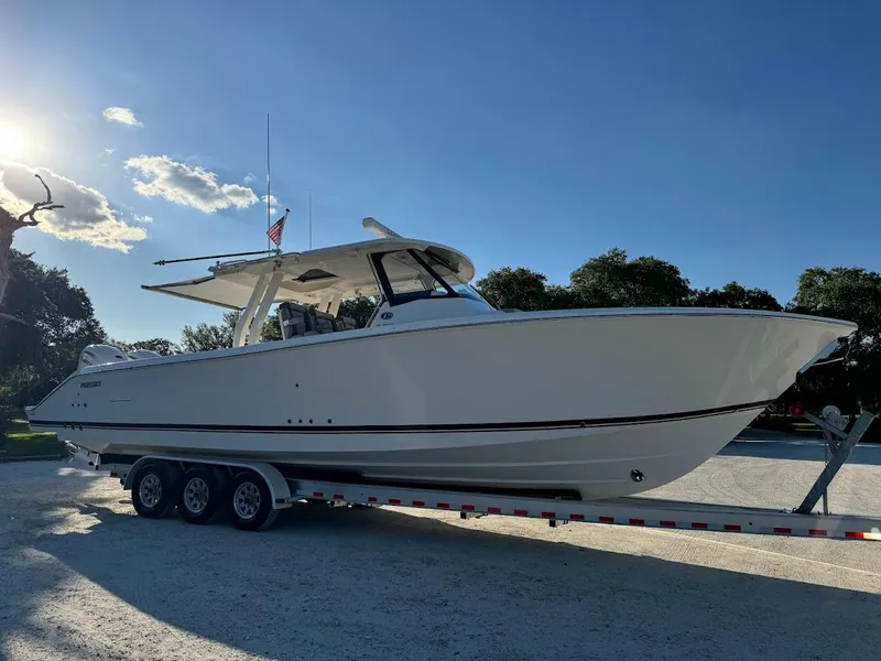 Slide: The Image of 2024 Pursuit S 358 Sport boat on trailer, side view, sunny day. - 9