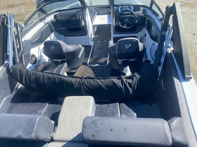 Slide: The Image of 2022 Scarab 195 ID boat interior with seating and steering console. - 15