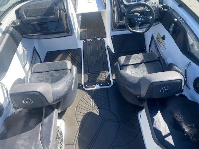 Slide: The Image of Interior of 2022 Scarab 195 ID boat with dual seating and steering wheel. - 16