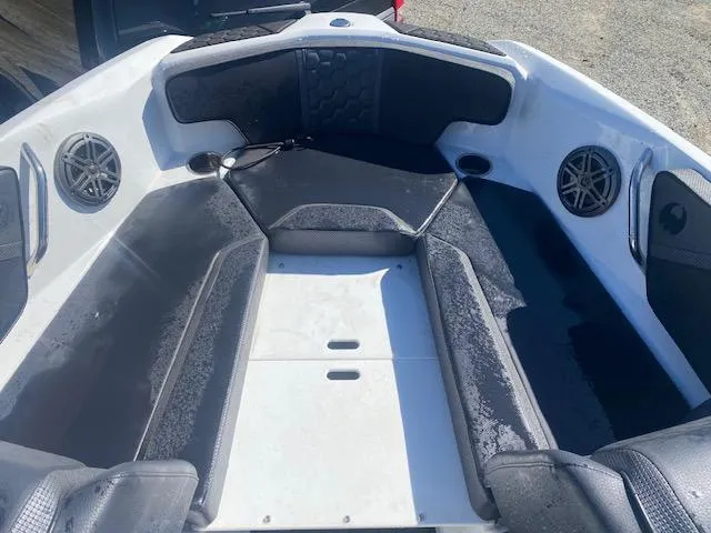 Slide: The Image of 2022 Scarab 195 ID boat interior with seating and speakers. - 20